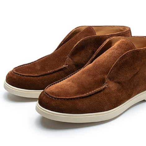 TLB Mallorca Parisian Brown suede slip-on ankle boots with moc-toe and white rubber sole.